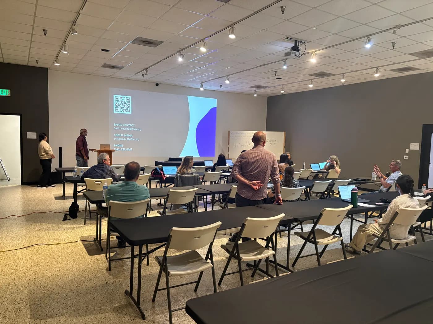 Small business owners working on laptops at a free CIF workshop